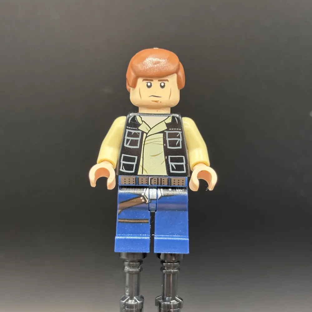 Han Solo - Black Vest with Pockets over Tan Shirt with Dark Tan Creases, Dark Blue Legs with Belts, Smooth Hair